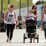 Kala Buchanan (center) walks with her daughter Avi and friends Kelli Beverstock (left) and Nikki Connite (right) along with Kelli&rsquo;s dog, Sonora, at Skagit Riverwalk Park in Mount Vernon. (Ian Terry / The Herald)