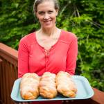 Joyce Sieben holds a fresh batch of her cardamom bread. (Ian Terry / The Herald)