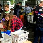 Volunteers unload bags of nonperishable food donated during the 2016 Letter Carriers Food Drive. Scheduled for May 13, the effort to help local food banks feed hungry people in Snohomish County will mark its 25th anniversary this year. (Volunteers of America Western Washington photo)