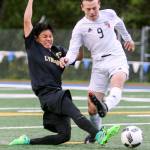 Lynnwood&rsquo;s Patrick Kreider shoots and scores past Snohomish&rsquo;s Owen Fieldler during Saturday&rsquo;s 3A District 1 championship match Saturday in Shoreline. Lynnwood won 4-1. (Kevin Clark / The Herald)