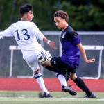 Kamiak&rsquo;s Andre&rsquo; Hamilton controls the ball past Mariner&rsquo;s Efren Martinez during a 4A district playoff game on May 13, 2017, in Lake Stevens. Kamiak won 2-1. (Kevin Clark / The Herald)