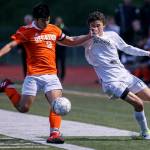 Decatur&rsquo;s Angel TrejoDelgado (left) and Glacier Peak&rsquo;s Keegan Rubio struggle for position during a 4A state playoff game on May 17, 2017, at Glacier Peak High School in Snohomish. (Kevin Clark / The Herald)