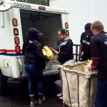 Volunteers unload bags of nonperishable food donated during the 2016 Letter Carriers Food Drive. Scheduled for May 13, the effort to help local food banks feed hungry people in Snohomish County will mark its 25th anniversary this year. (Volunteers of America Western Washington photo)