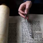 Rabbi Berel Paltiel holds a yad, used to help the reader follow the text of a Torah, at the Chabad Jewish Center of Snohomish County on Tuesday in Lynnwood. This Torah will be read during the Jewish holiday of Shavuot, through Thursday. (Andy Bronson / The Herald)