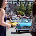 Pedestrians cross during the newly restored Cruzin Colby Sunday afternoon in downtown Everett on May 28, 2017. (Kevin Clark / The Herald)