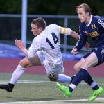 Glacier Peak&rsquo;s Miles Johnston chases down the ball with Mariner&rsquo;s Roman Voloshchuk trailing during the 4A District 1 title match on May 11, 2017, at Lake Stevens High School. (Kevin Clark / The Herald)