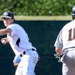 Glacier Peak&rsquo;s Ryan Ober winds up to throw to first base with Monroe&rsquo;s Brian Pino tracking during a game May 3, 2017, at Glacier Peak High School in Snohomish. (Kevin Clark / The Herald)