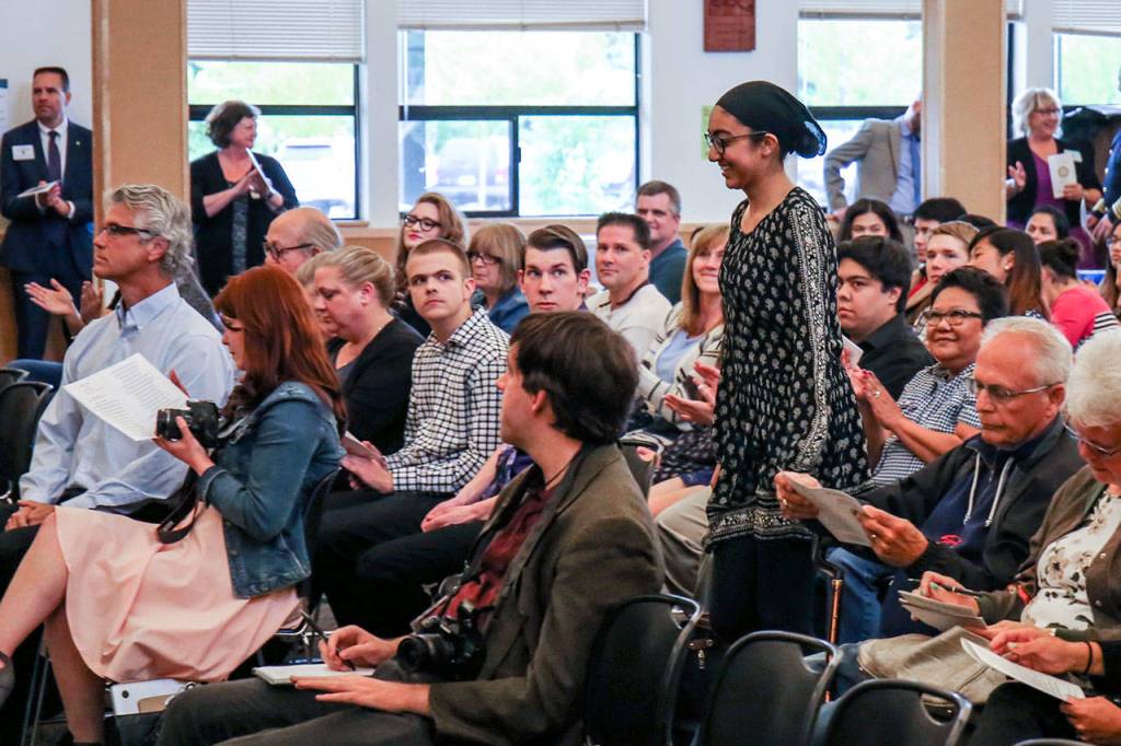 Inder Deol makes her way to the stage to receive her scholarship Wednesday at Marysville Arts & Technology High School. (Kevin Clark / The Herald)