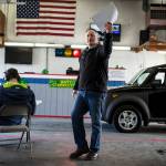 Auctioneer Dennis Lautenbach calls out for a higher bid on a used Honda Element during a dealer auction at Kaman Auctions in Edmonds. (Ian Terry / The Herald)