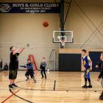 Kids play basketball in the new gym. (Ian Terry / The Herald)