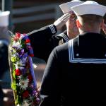 MA3 Steven Andrew Orick Jr. (center left) stands at attention during the wreath presentation at a ceremony held at Naval Station Everett on Thursday marking Memorial Day. (Ian Terry / The Herald)
