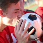 Archbishop Murphy&rsquo;s Chase Whittaker kisses the trophy after beating East Valley in the 2A state soccer championship match on May 27, 2017, at Sunset Chev Stadium in Sumner. (Kevin Clark / The Herald)