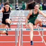 Shorecrest&rsquo;s Marieke Visscher (right) takes first place over Lynnwood&rsquo;s Rita Sakharov (left) in the 110-meter hurdles at the Wesco 3A South track and field championships on May 12, 2017, at Edmonds Stadium. (Kevin Clark / The Herald)