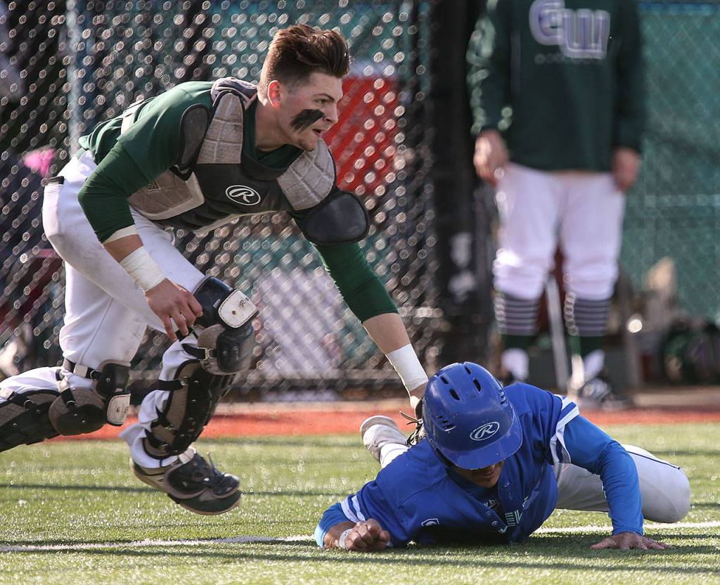 Edmonds-Woodway&rsquo;s Kosta Cooper tags out Shorewood&rsquo;s Arthur Pate to end a rundown Saturday during the 3A District 1 championship game in Shoreline. Edmonds-Woodway beat Shorewood 2-1. (Kevin Clark / The Herald)