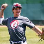 Trent Tinglestad throws from the outfield during practice Friday afternoon at Everett Memorial Stadium in Everett on May 19, 2017. (Kevin Clark / The Herald)