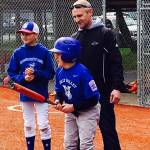 Jacob Irish contemplates a turn at bat. He is helped by his father, Steve Irish, and brother Noah, 11, at a recent game with the Stilly Valley Little League Challenger Division. The Challenger program gives kids with special needs a chance to play baseball. (Melanie Irish photo)