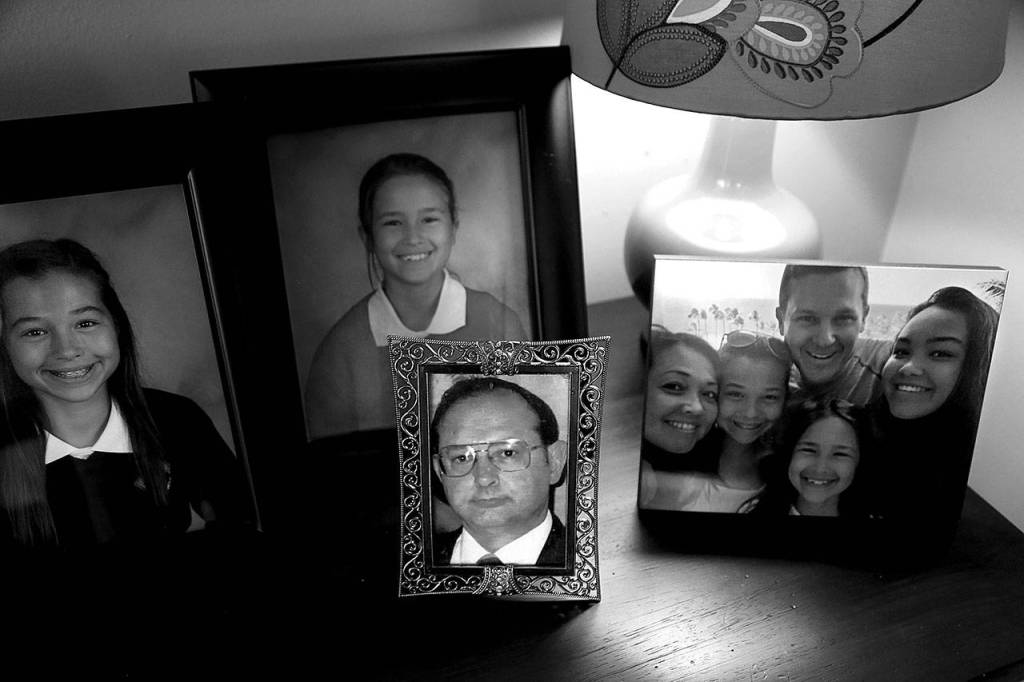 Mayume Carelli&rsquo;s home is filled with faces of people she loves. Her dad, Dan Varnell (center) was murdered by Gail Brashear in 1996. (Dan Bates / The Herald)