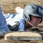 Glacier Peak&rsquo;s Riley Parker is tagged out at first base during a game against Monroe on May 3, 2017, at Glacier Peak High School in Snohomish. (Kevin Clark / The Herald)