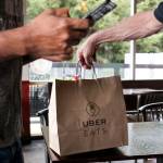 A driver picks up an order from Red Onion Burgers in Mountlake Terrace. (Kevin Clark / The Herald)