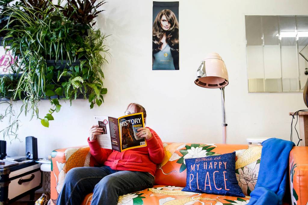 Eclectik Salon&rsquo;s waiting area creates a comfortable atmosphere for clients that&rsquo;s more akin to a living room than a hair salon. (Ian Terry / The Herald)