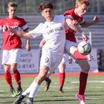 Archbishop Murphy&rsquo;s Matt Williams (right) shots and scores past East Valley&rsquo;s Fabian Kirby during the 2A state soccer championship match on May 27, 2017, at Sunset Chev Stadium in Sumner. (Kevin Clark / The Herald)