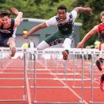 Arlington&rsquo;s Campbell Hudson (left), Edmonds-Woodway&rsquo;s Aaron Richardson (center) and Stanwood&rsquo;s Tyler Younce compete in the 110-meter hurdles during the 3A District 1 track and field championships on May 19, 2017, at Shoreline Stadium. (Kevin Clark / The Herald)