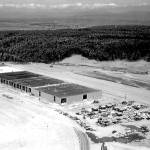 Dozens of cars and a new building under construction at Paine Field, date unknown. Local officials pledged to do whatever was needed to land the factory, which Boeing expected would employ about 15,000 people. Today, roughly 40,000 people work at the sprawling plant and office buildings.