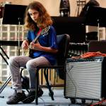 Elijah Croyle practices a short while on an electric guitar before joining the bassoon section and the rest of the band Wednesday last week at Valley View Middle School in Snohomish. (Dan Bates / The Herald)