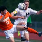 Decatur&rsquo;s Justin Cho (left) and Glacier Peak&rsquo;s Miles Johnston vie for control of the ball during a 4A state playoff game on May 17, 2017, at Glacier Peak High School in Snohomish. (Kevin Clark / The Herald)