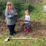 Teacher Patti Baughn and Amber Aleksich take part in a tree-planting event at Alderwood Early Childhood Center. (Contributed photo)