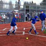 Jacob takes off up the first base line with his brother, Noah, following close behind after making a hit while playing some ball with the Stilly Softball girls team. (Courtesy Stilly Valley Little League)