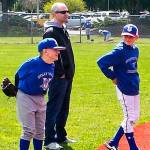 Jacob is all smiles as he plays second base. He is helped by his father, Steve Irish, and brother Noah. (Melanie Irish photo)