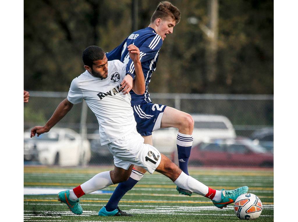 Lynnwood&rsquo;s Rofaiel Dawood steals the ball from Squalicum&rsquo;s Connor Miller during the 3A District 1 tournament semifinal game May 9 at Shoreline Stadium. Lynnwood went on to defeat Squalicum 2-1. (Ian Terry / The Herald)
