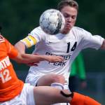 Decatur&rsquo;s Justin Cho (left) and Glacier Peak&rsquo;s Miles Johnston vie for control of the ball at Glacier Peak High School in Snohomish on May 17. (Kevin Clark / The Herald)