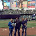 Monroe dairy farmers Jim and Dolores Werkhoven (right, with grandson Orson) were recognized at the May 5 Seattle Mariners game for their outstanding community service. (Contributed photo)