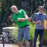 Kevin Beavers chips on to the green under watchful eyes Monday during the final round of the Snohomish County Amateur golf tournament at Snohomsih Golf Course. Beavers finished 9-under par to become the second player ever to win the tournament three straight years. (Andy Bronson / The Herald)