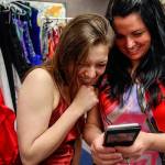 An emotional Mal Byron, 17, reacts with joy Thursday morning at Crossroads High School when she sees a picture of herself in a prom dress on teacher Tracy Orr&rsquo;s phone. (Dan Bates / The Herald)