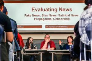 EvCC Clipper Editor Abby Tutor (left) and journalism instructor T. Andrew Wahl listen as librarianTeresa Jones responds to a question from the crowd Tuesday in the Henry M. Jackson Center&rsquo;s Wilderness Room, which was packed for the panel discussion about fake news (Dan Bates / The Herald).