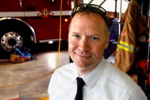 Firefighter Bill Ekse helped coordinate part of a statewide effort to get old firefighting gear to crews in Peru who are dealing with disaster. Mill Creek&rsquo;s Fire District 7 donated 20 sets of the gear. (Dan Bates / The Herald)