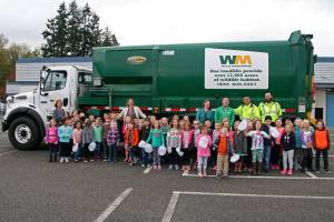 Kids collect jugs for recycling lesson