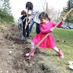 Preschoolers plant trees for their future