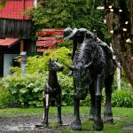 A whimsical sculpture of a western scene centers one of several cozy courtyards found between the shop buildings in Bothell&rsquo;s Country Village on Thursday. (Dan Bates / The Herald)