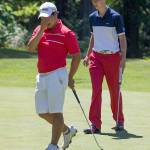 Alvin Kwak (left) reacts as his putt stops on the lip of the cup Monday during the final round of the Snohomish County Amateur golf tournament at Snohomsih Golf Course. Kwan finished tied for fourth and took first place in the junior category. (Andy Bronson / The Herald)