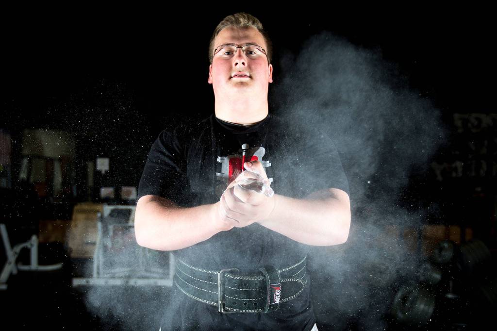 Everett High School junior Ben Howard lifts weights at EGO Strength and Performance in South Everett on April 28. (Ian Terry / The Herald)