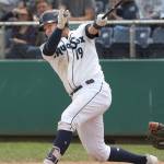 Aquasox catcher Juan Camacho hits a solo home run in the seventh inning as the Everett Aquasox lost 9-2 to the Hillsboro Hops at Everett Memorial Stadium on June 19. (Andy Bronson / The Herald)