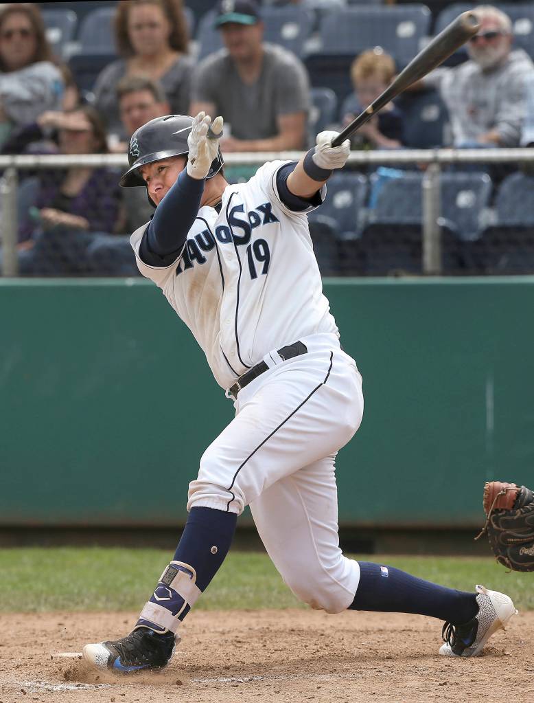 Aquasox catcher Juan Camacho hits a solo home run in the seventh inning as the Everett Aquasox lost 9-2 to the Hillsboro Hops at Everett Memorial Stadium on June 19. (Andy Bronson / The Herald)