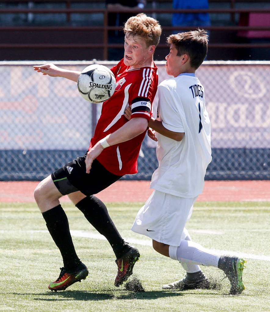 Snohomish&rsquo;s Jason Fairhurst (left) fights for possession of a ball with Gig Harbor&rsquo;s Tyler Meyer during a state 3A semifinal game at Sparks Stadium in Puyallup on May 26. (Ian Terry / The Herald)