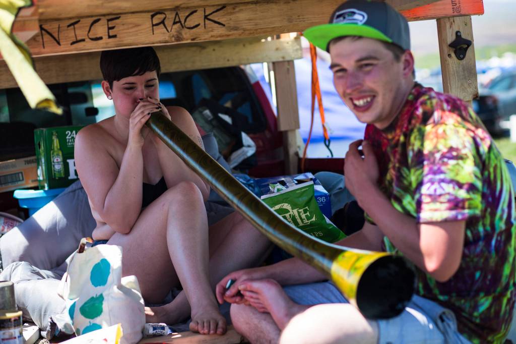 Amber Holden plays the Didgeridoo with her friend Nick Fitzpatrick during day three of the annual Sasquatch! Music Festival on Sunday, May 28, 2017 in George, Wa. (Daniella Beccaria / For the Herald )