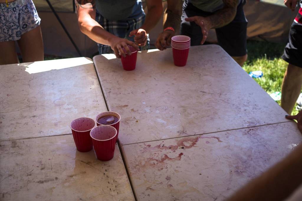 Campers play a round of drinking games before heading into the festival grounds during day three of the annual Sasquatch! Music Festival on Sunday, May 28, 2017 in George, Wa. (Daniella Beccaria / For the Herald )