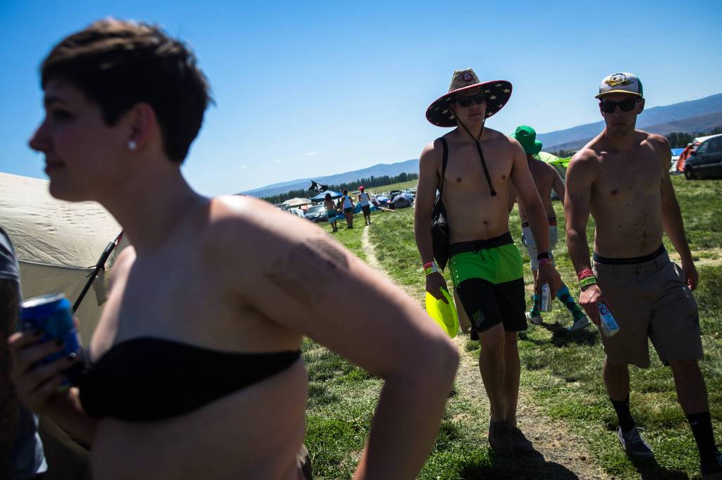 Festival-goers walk through the campgrounds during day three of the annual Sasquatch! Music Festival on Sunday, May 28, 2017 in George, Wa. (Daniella Beccaria / For the Herald )